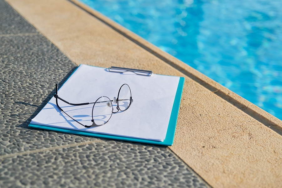 Pool inspection notes beside the water